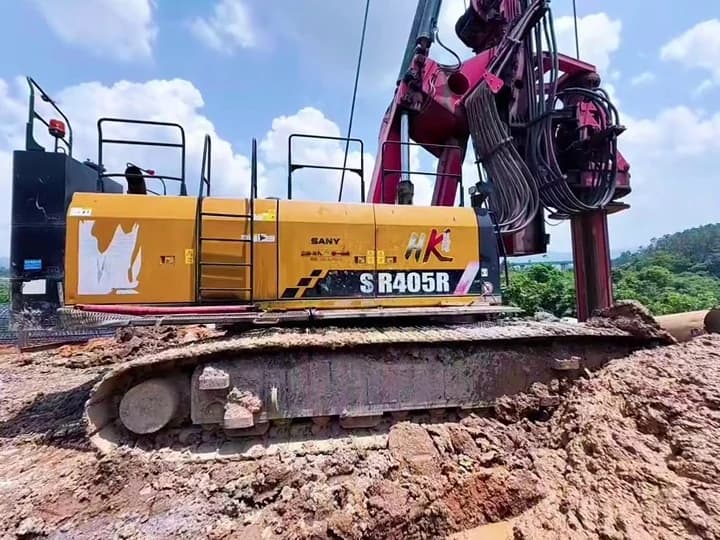 SANY SR405R rotary drilling rig standing at a machinery site