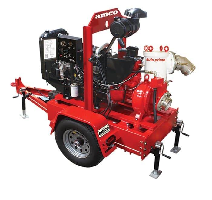 Red trailer-mounted dewatering pump with diesel engine, control panel and white auto-prime assembly. Reference equipment photograph.