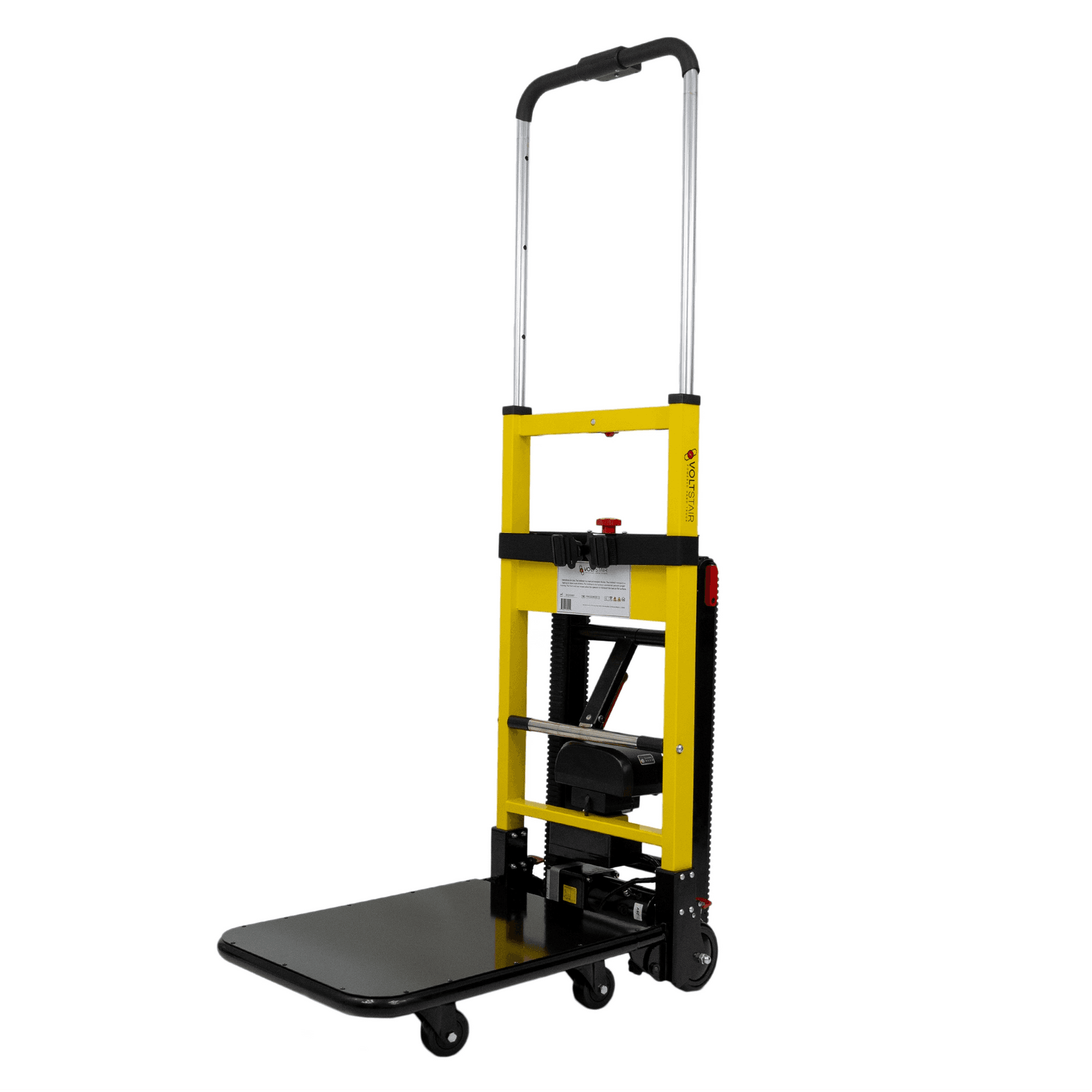 Yellow powered stair-climbing hand truck with extended handle, load platform, securing strap and tracked climbing drive on a white background. Reference equipment photograph.
