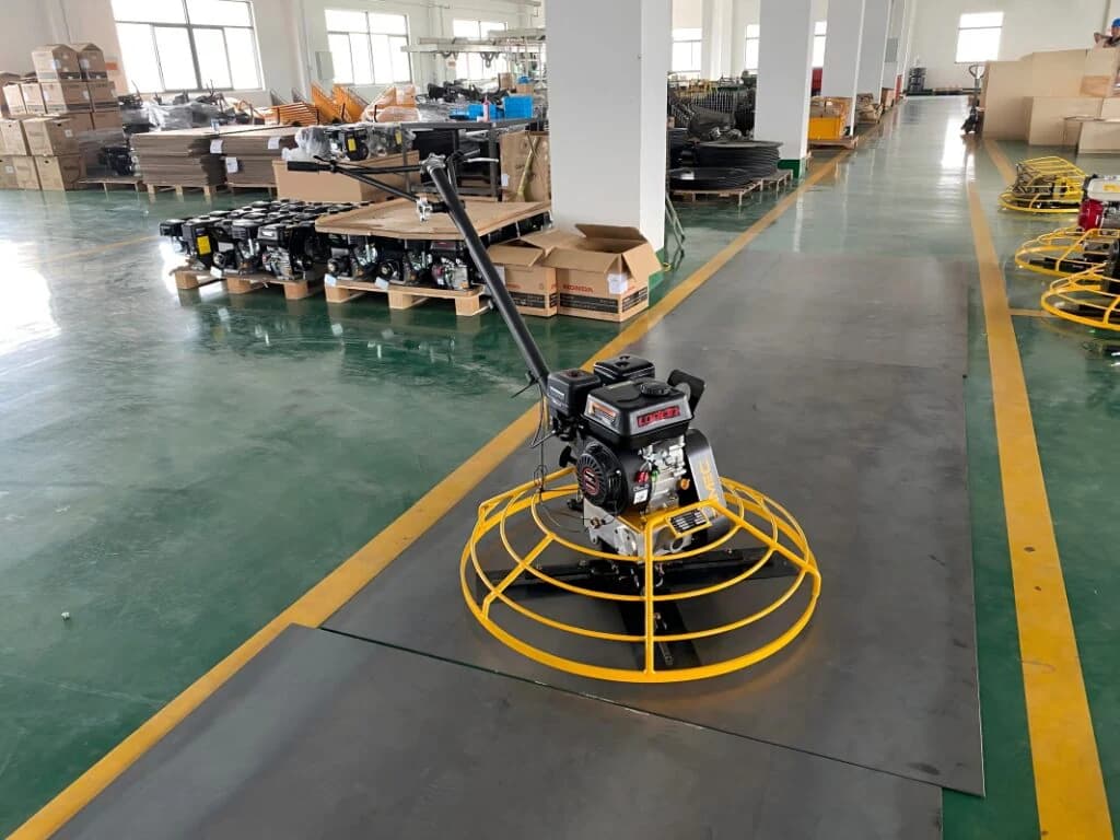 Side view of the yellow DIMEC PME-S100 walk-behind trowel and petrol engine