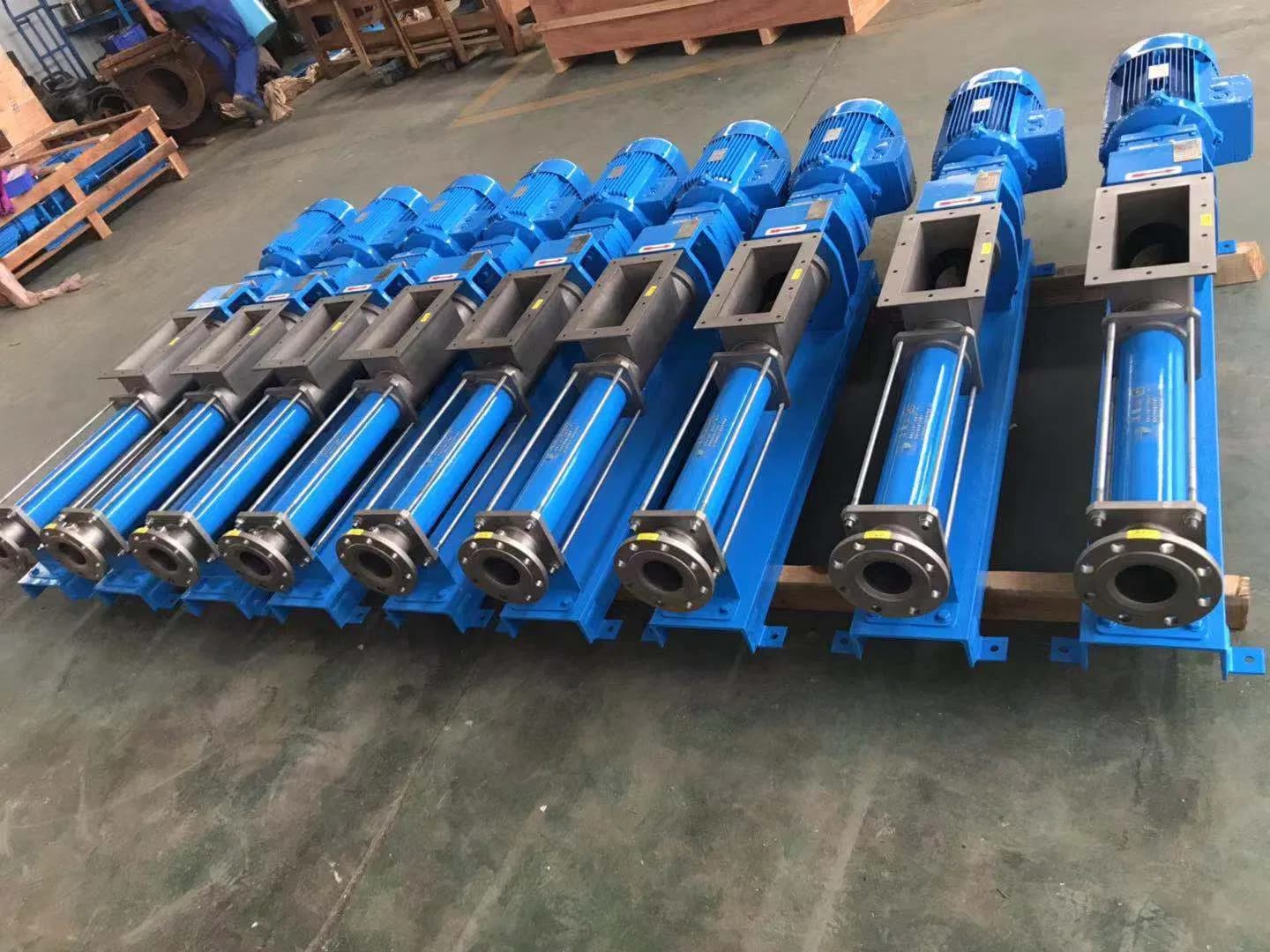 Photograph of blue hopper-fed single-screw pumps in a workshop. The supplier lists this pump type for ice slurry; no ice-slurry test or operating duty is shown. Reference equipment photograph.