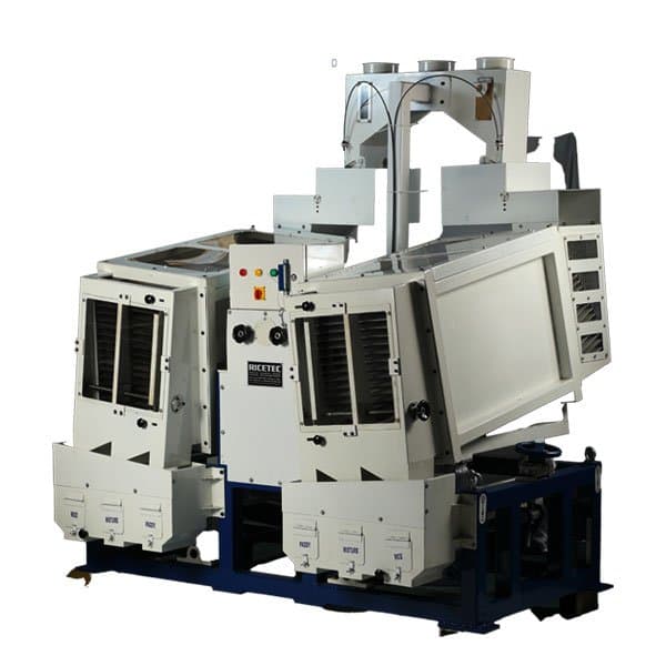 White multi-deck paddy separator assembly with control switches and grain transfer section. Reference equipment photograph.