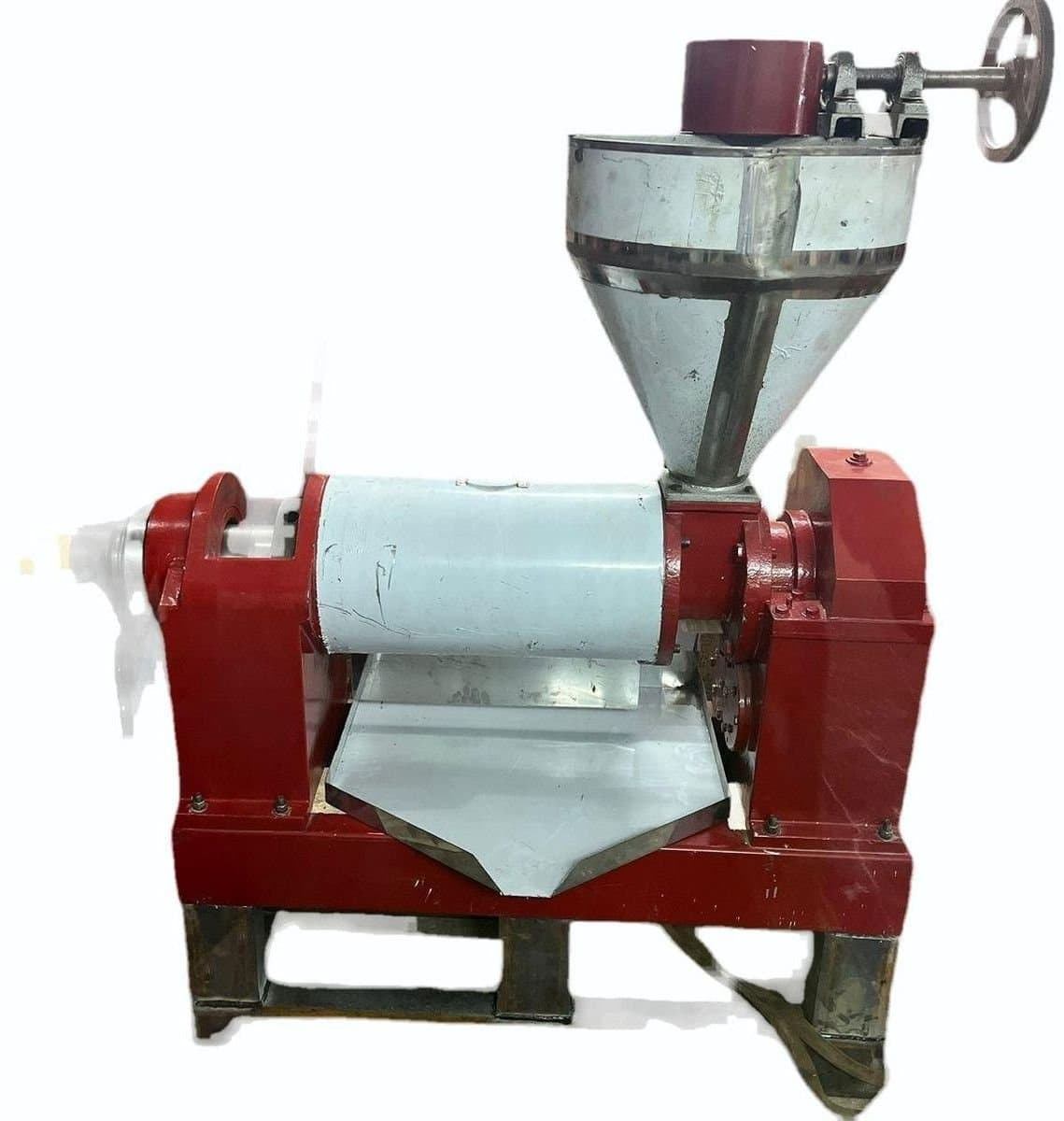 Compact oil expeller with hopper, pressing body, motor and frame. Reference equipment photograph.