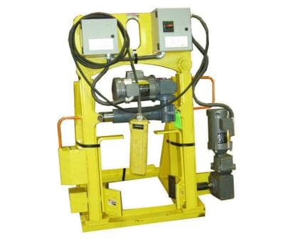 Hunter Lift yellow powered drum rotation attachment with drive and clamp frame. Reference equipment photograph.