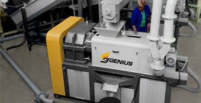 Genius plastic film squeeze dryer with its dewatering screw housing and discharge arrangement. Reference equipment photograph.