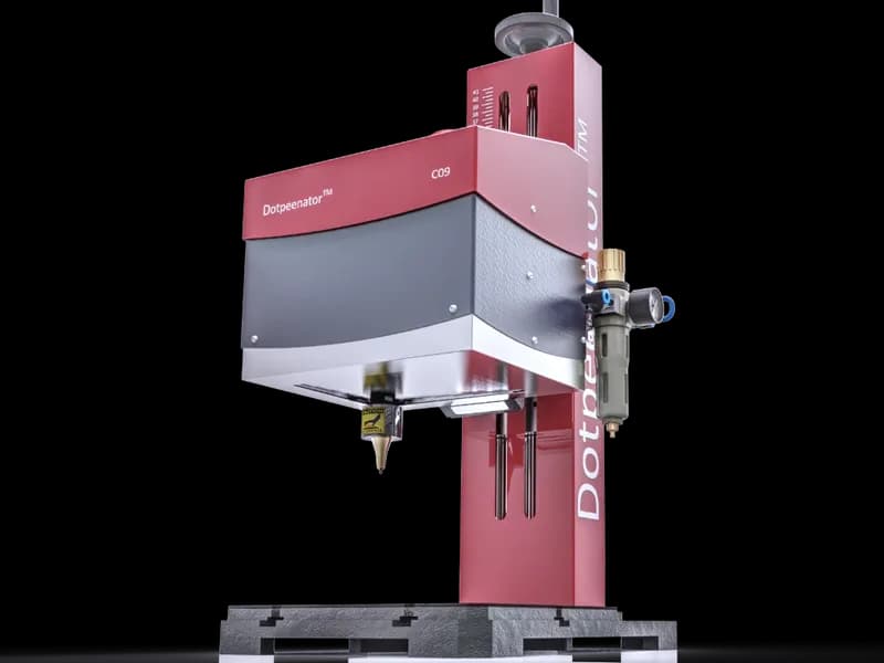 Dotpeenator CO9 desktop pin-marking machine with column and worktable. Reference equipment photograph.