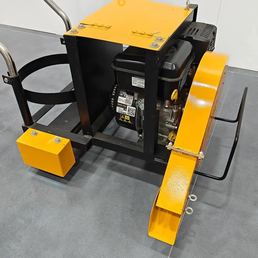 JACKWIN road marking blower with an engine and close-to-pavement directed air outlet. Reference equipment photograph.
