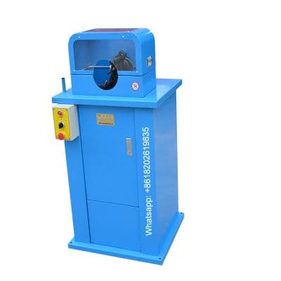 Blue hose skiving machine with a guarded rotating tool spindle and control panel. Reference equipment photograph.