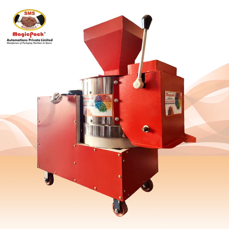 Red seed coating machine with a stainless treatment chamber and feed hopper. Reference equipment photograph.