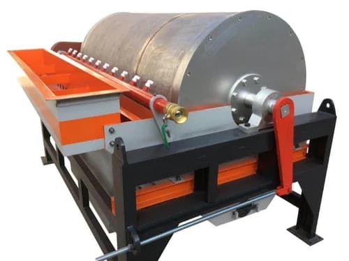 Wet magnetic separator with an exposed metal drum, feed housing and support frame. Reference equipment photograph.