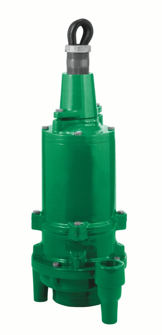 Green submersible grinder pump with lifting loop, outlet and attached power cable. Reference equipment photograph.