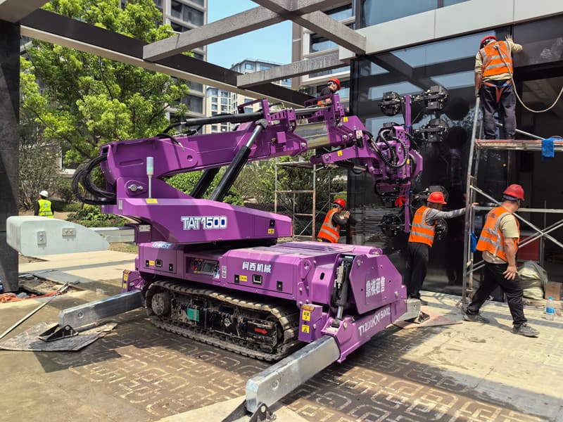 Cowest TAT1500 on crawler tracks with stabilizers at a construction site. Reference equipment photograph.