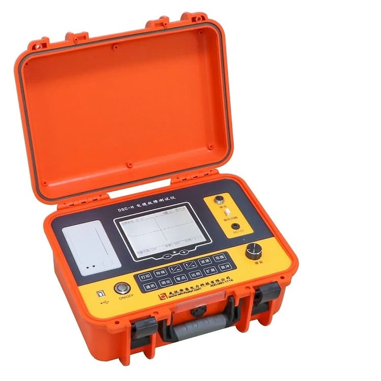 Orange cable fault test instrument with a waveform display and carrying case. Reference equipment photograph.