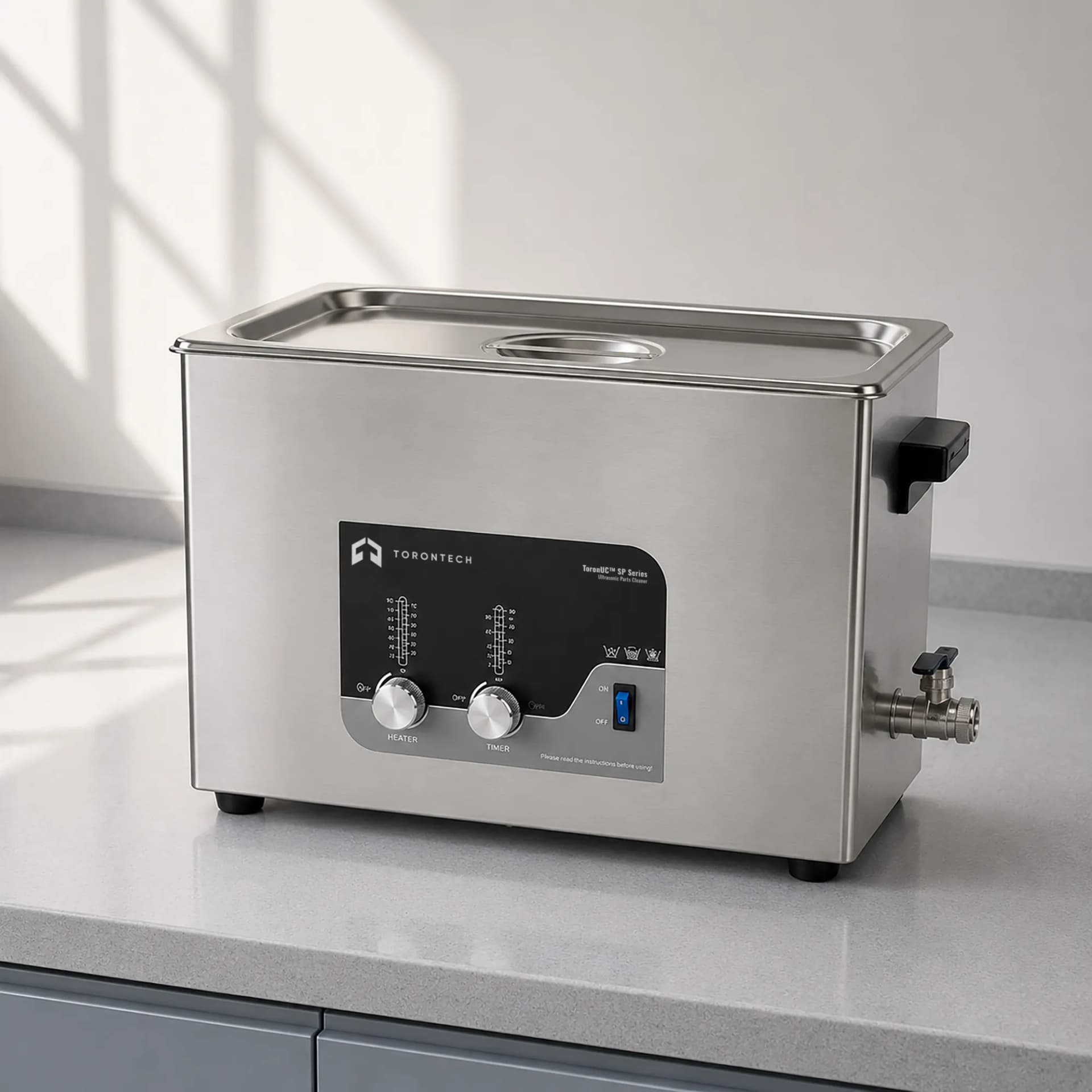 Torontech ultrasonic bath with stainless tank, heater controls and drain valve. Reference equipment photograph.