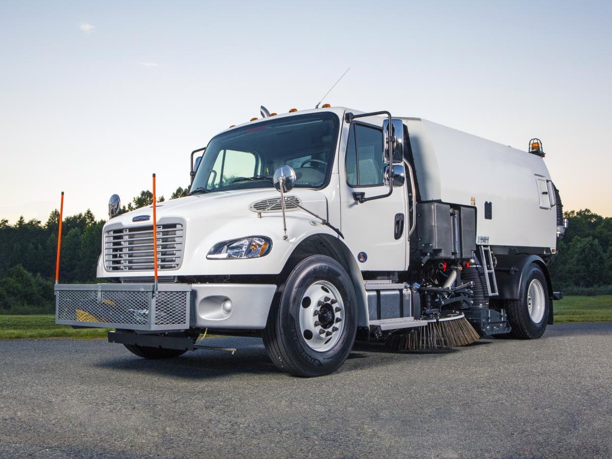 Bucher MaxPowa V65 truck-mounted vacuum sweeper with debris hopper and pavement pickup equipment. Reference equipment photograph.