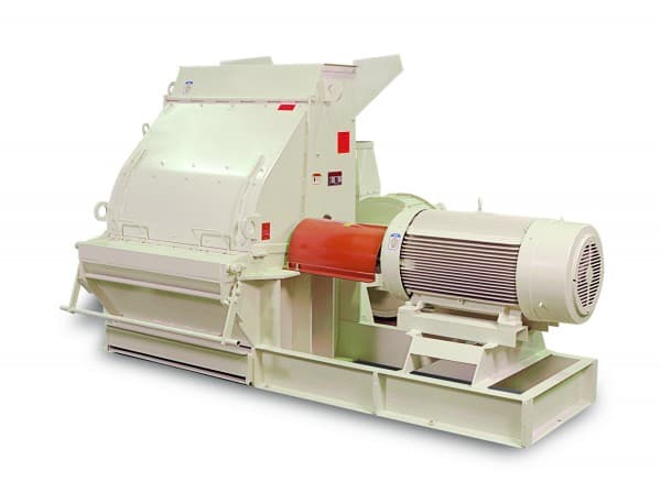Schutte 15 Series industrial wood hammer mill showing its feed opening, milling housing and motor on a base frame. Reference equipment photograph.