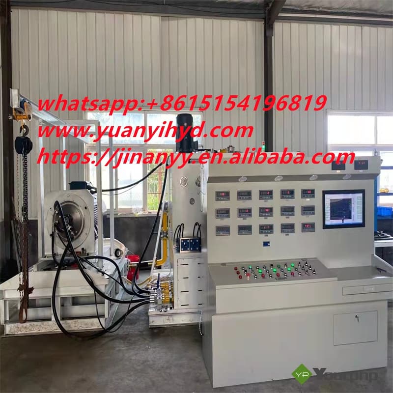 Hydraulic pump test bench photographed in a workshop, with pump mounting drive, hydraulic hoses, gauges and instrument/control console; manufacturer's red contact watermark retained. Reference equipment photograph.