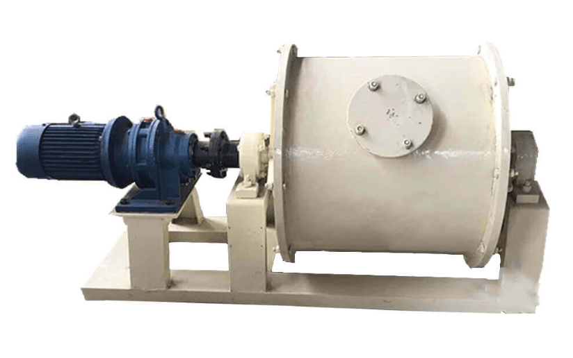 Compact cream-colored ball mill drum on a base with an electric drive motor. Reference equipment photograph.