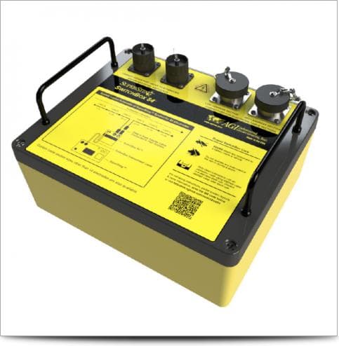 Yellow rugged switching box with several electrode-cable connectors. Reference equipment photograph.