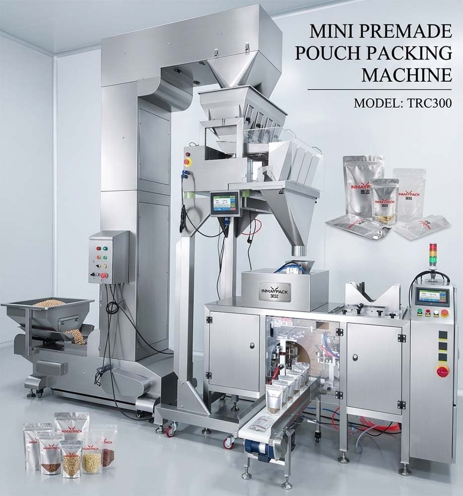 TRC300 premade-pouch packaging machine with its pouch-handling enclosure and associated dosing equipment. Reference equipment photograph.