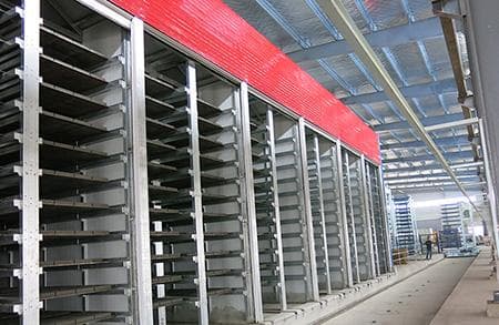 HONGYI concrete block curing racks inside the climate enclosure. Reference equipment photograph.