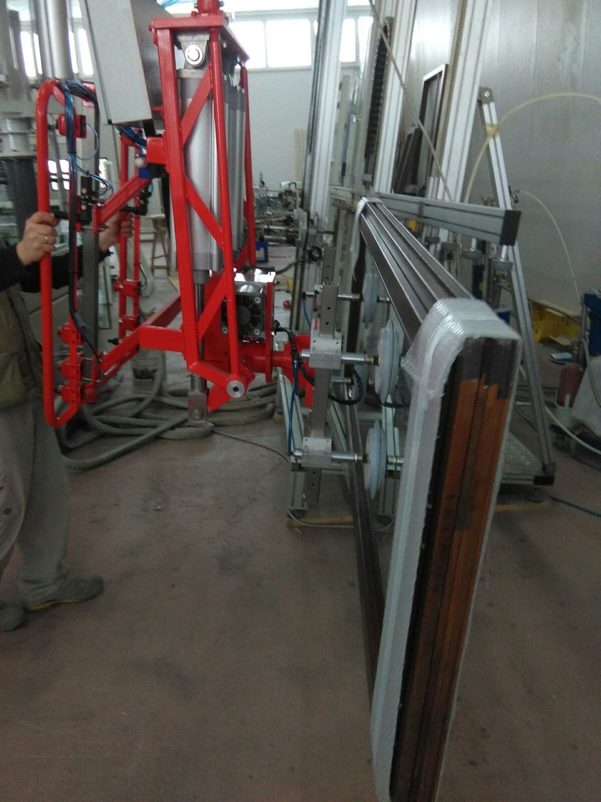 RHS glass vacuum handling head in a workshop