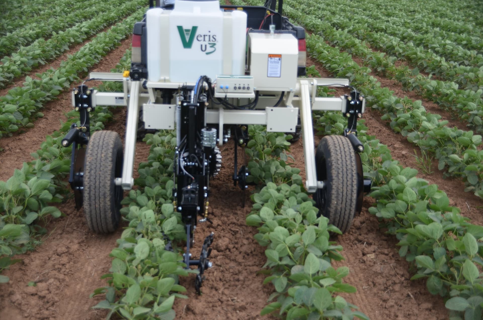 Veris U3 wheeled soil-scanning implement photographed between crop rows. Reference equipment photograph.