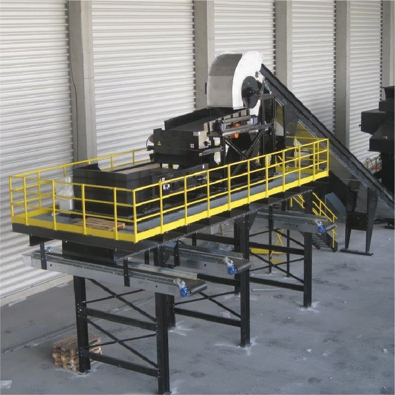 Gauss Magneti eddy-current separation equipment installed with conveyors and an access platform. Reference equipment photograph.