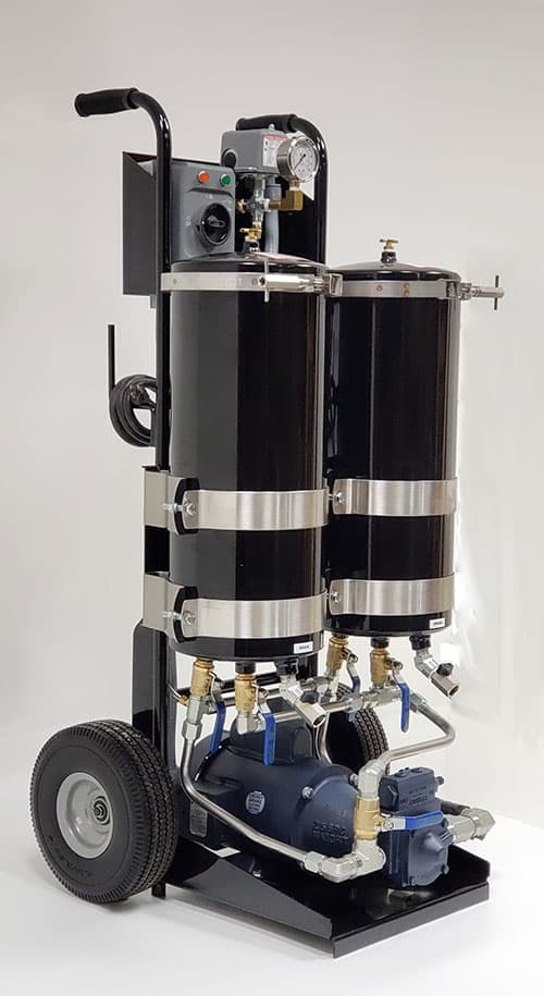 Wheeled filtration cart with two filter housings, pump and connection fittings. Reference equipment photograph.