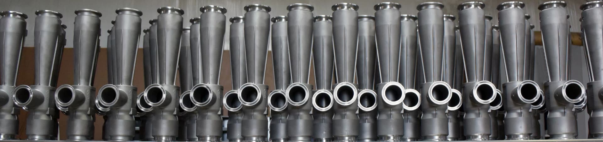 Mazzei stainless venturi injection bodies photographed together as manufacturer product references. Reference equipment photograph.