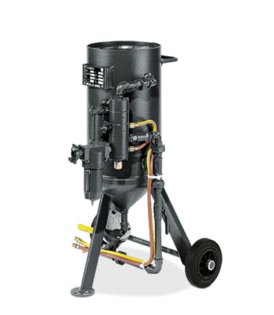 Clemco wheeled pressure blast pot with piping and control fittings. Reference equipment photograph.