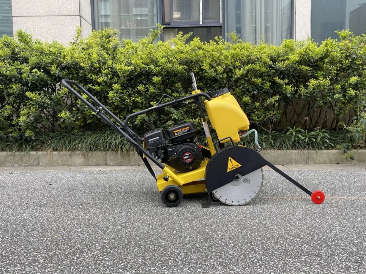 Yellow DIMEC PME-Q300 floor saw with water tank, blade guard and front guide wheel