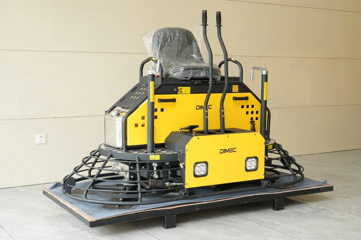 DIMEC PME-RS100 ride-on trowel on a pallet showing its seat, twin levers and rotor guards