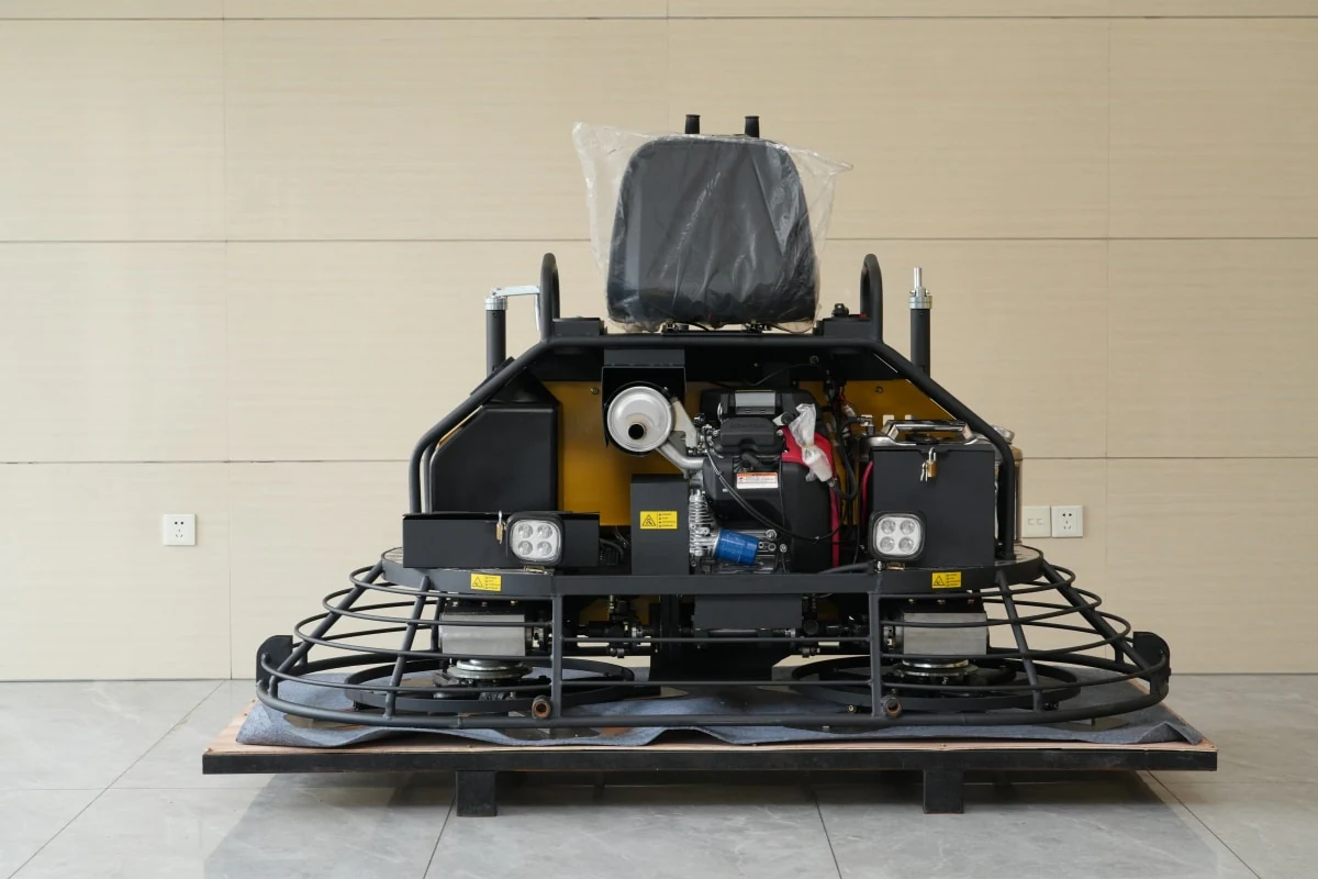 Rear view of the DIMEC ride-on trowel showing its engine compartment and guarded twin rotors