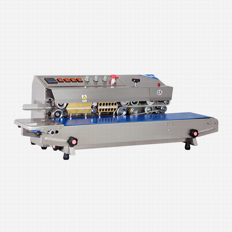 Angled view of Hualian FRM-810I showing sealing rollers, controls and conveyor