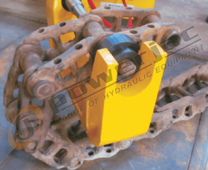 Manufacturer application view of a C-frame press positioned around a track-chain pin